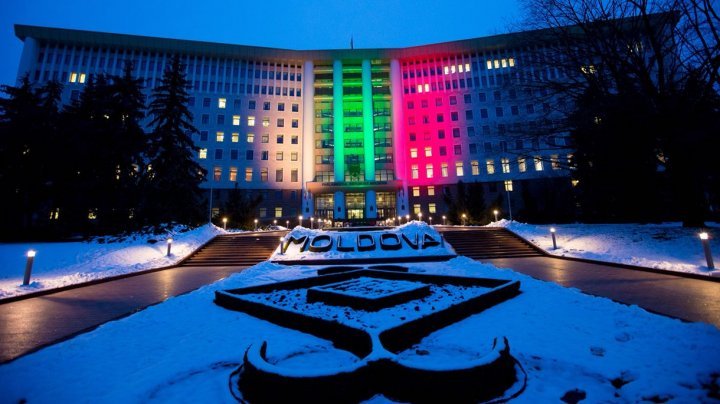 Lights spectacle in the square of Moldovan Parliament. Building was illuminated in Lithuanian flag colors