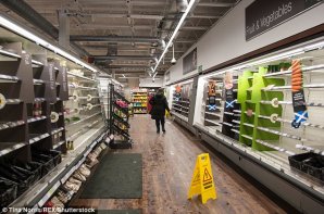 Supermarket shelves have been left bare as shoppers panic-buy essentials including milk and bread