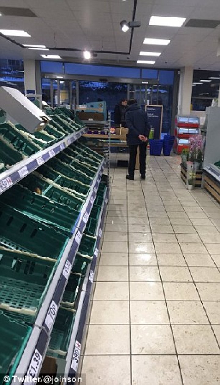 Supermarket shelves have been left bare as shoppers panic-buy essentials including milk and bread