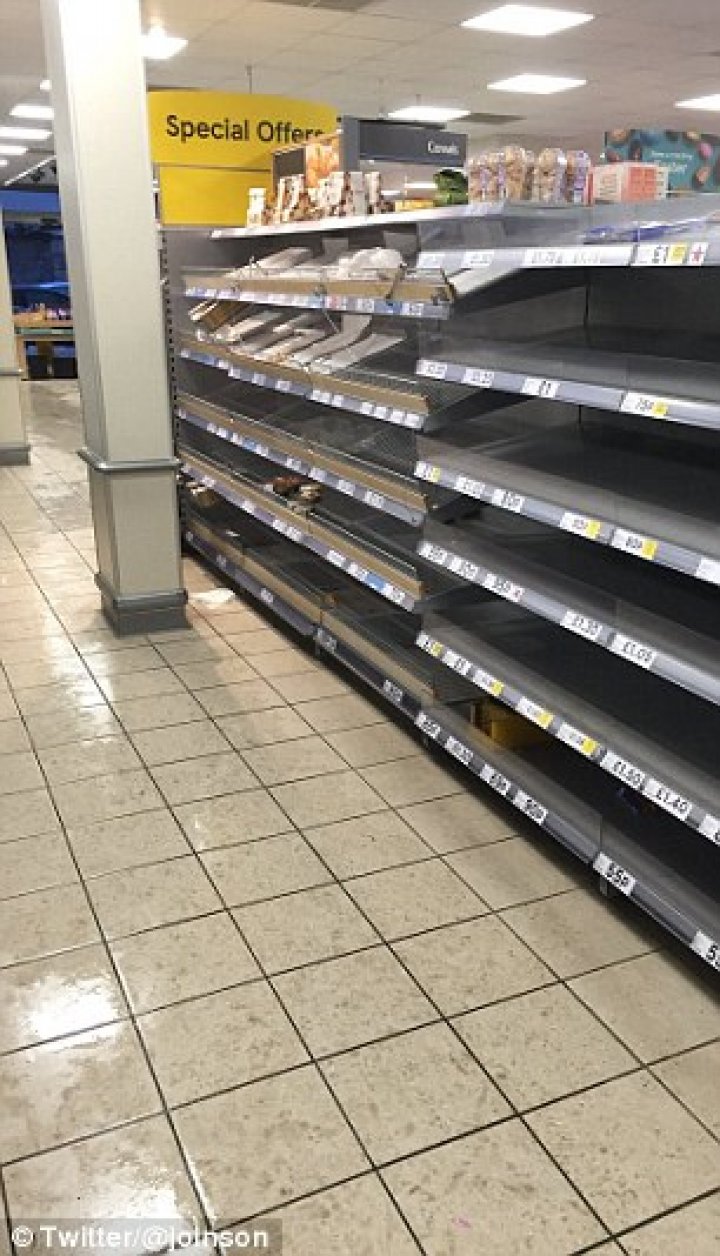 Supermarket shelves have been left bare as shoppers panic-buy essentials including milk and bread