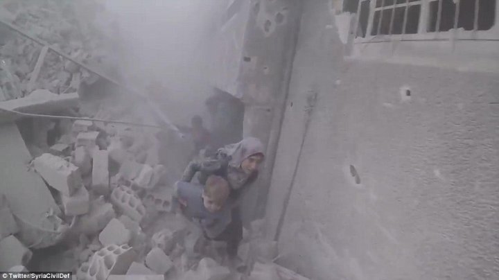 Horrifying footage from the rebel-held enclave of Eastern Ghouta in Syria shows women and children running for their lives as dust settles after yet another government air strike