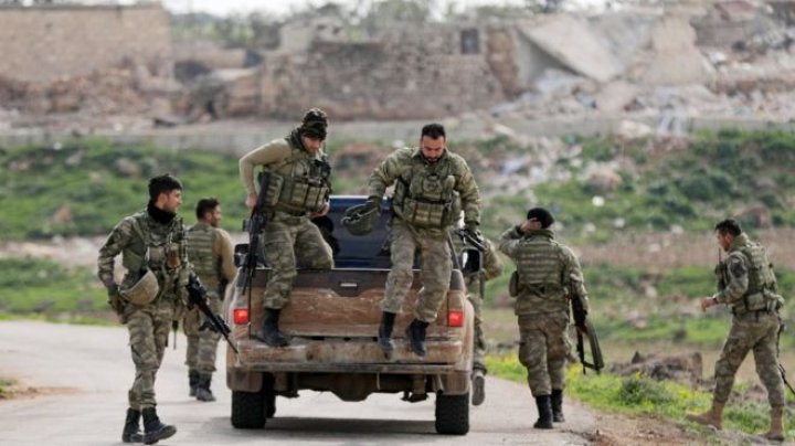 Turkish military says it has surrounded the Kurdish-held city of Afrin in northern Syria, focus on offensive against Kurdish militia