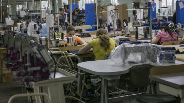 Chiril Gaburici visits Moldova's oldest clothing factory and hands female employees flowers