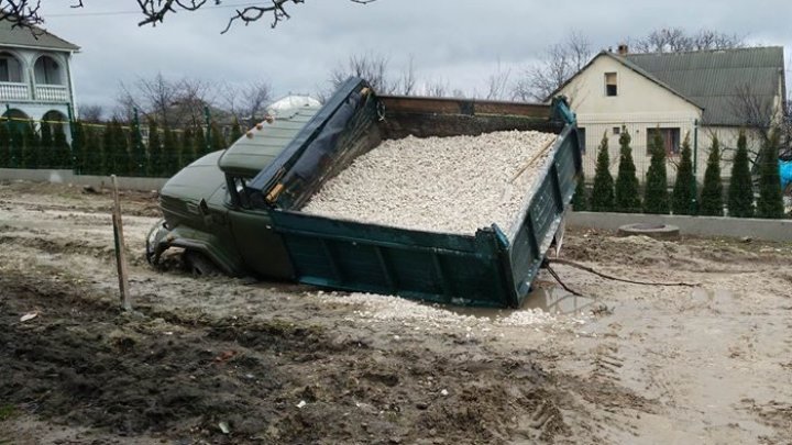 A truck trapped in muddy road in Mileştii Mici village