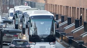 Buses believed to be carrying expelled American diplomats have departed from the U.S. Embassy in Moscow