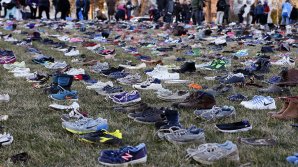 4,500 pairs of shoes representing lives lost in Mideast greet EU FMs