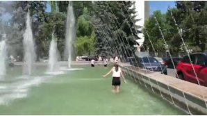 Students jumped in pool from the front of Maria Biesu Theater of Opera and Ballet