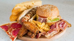 Theresa May demands bans on junk food advertising before 9pm