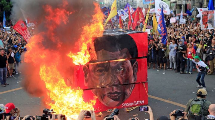 May Day protesters burn effigy of President Duterte