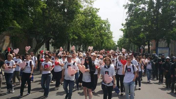 LGBT rally through Chisinau. Aggressive anti-march people controlled by force 