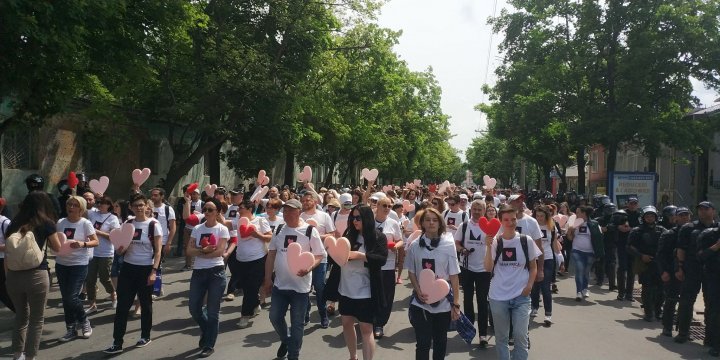 LGBT rally through Chisinau. Aggressive anti-march people controlled by force 