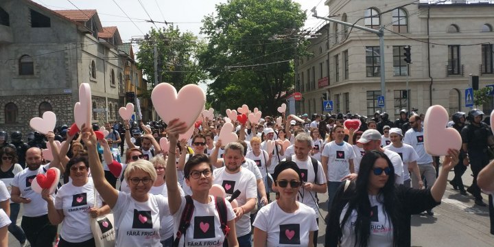 LGBT rally through Chisinau. Aggressive anti-march people controlled by force 