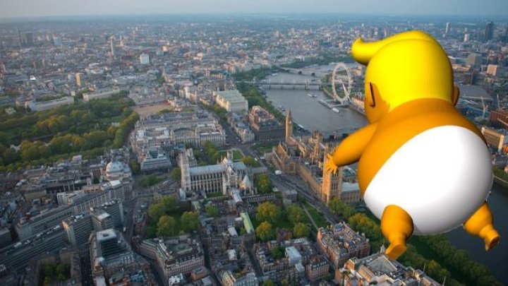 Giant baby Donald Trump flies over London, as US president is about to visit the UK