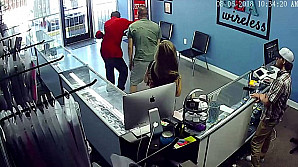 Shocking moment a couple's trip to a cellphone store turned into a violent affair when the boyfriend caught another man staring at his girlfriend's bottom