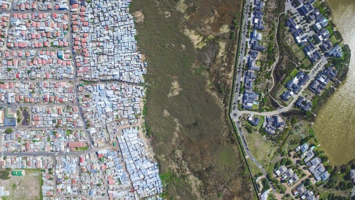 Aerial images by drone reveal the dramatic divide between rich and poor in cities in South Africa, Mexico and India