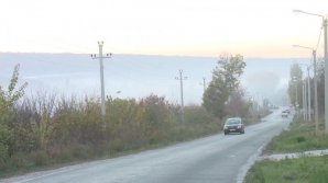 Apocalyptic landscape in Truseni. A dense smoke has covered the village after people have set fire to dry leaves