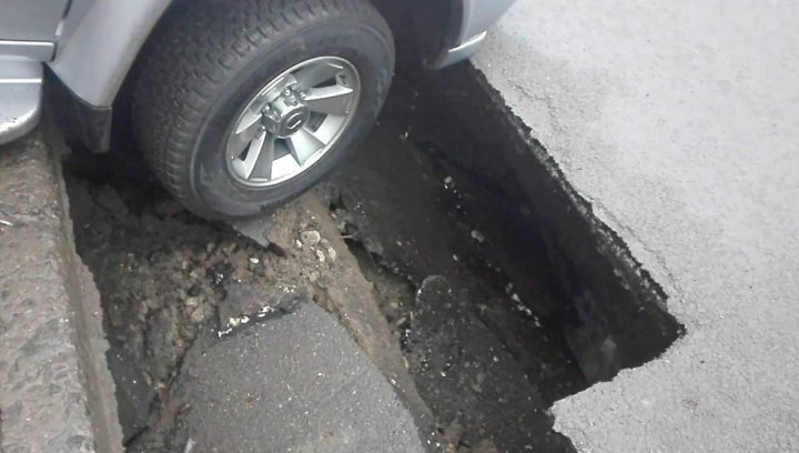 Car fell into a hole place behind the Parliament's building. Is the driver Parliament's employee