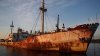 Greece pulls abandoned, half-sunken ships out of the sea