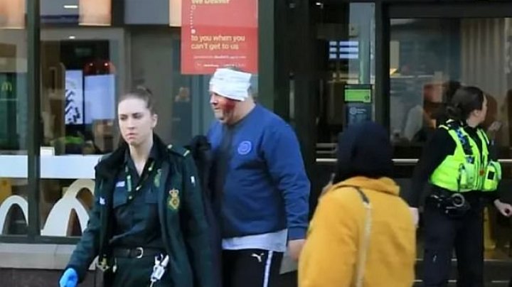 Machete attacker pinned to the ground by police after allegedly slashing a McDonald's diner across the face this morning