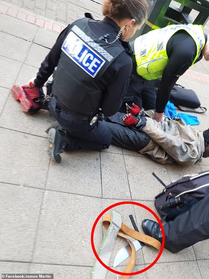 Machete attacker pinned to the ground by police after allegedly slashing a McDonald's diner across the face this morning