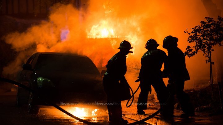 Two cars burned on a street from Capital