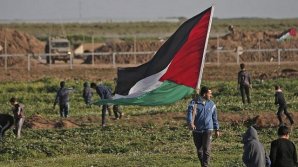 14-year-old Palestinian boy was shot and killed during mass protests along the Gaza border
