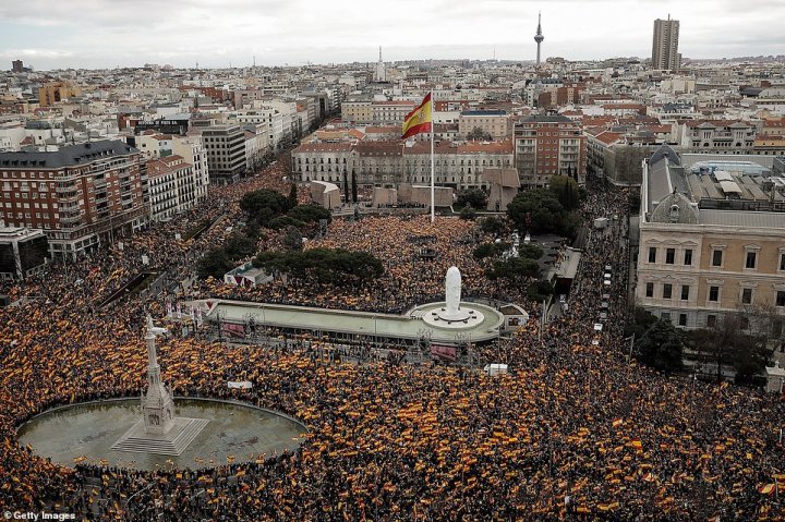 Thousands of protesters packed Madrid in a fierce backlash against Spanish Prime Minister and his planned talks with Catalan separatists