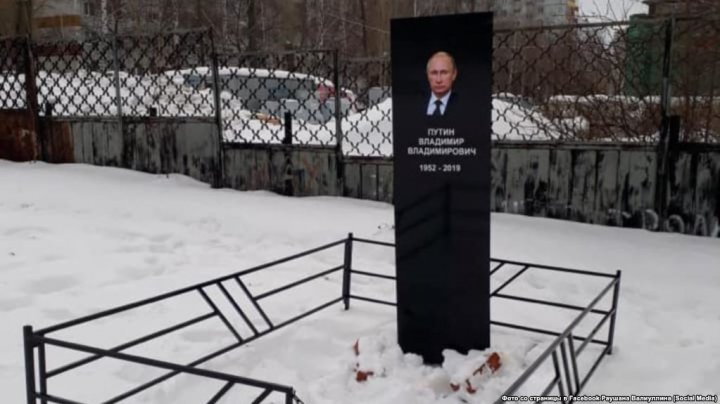 Activists jailed for putting up a mock gravestone. Whose name on granite slab 