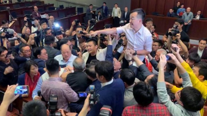 Hong Kong lawmakers brawl over contentious extradition law