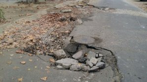 Two-month asphalt layer is now filled with pits on 31 August street near the Emergency Hospital 