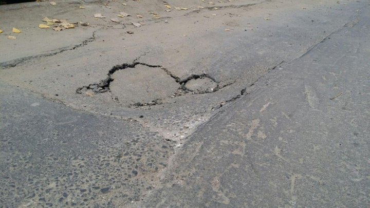 Two-month asphalt layer is now filled with pits on 31 August street near the Emergency Hospital 