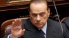 Berlusconi este acuzat că ar putea profita de noile măsuri de austeritate, care l-ar scuti de o datorie mai veche