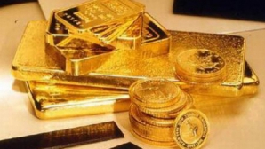 Aurul - principalul refugiu pentru investitori. Preţul unei uncii a atins azi cel mai înalt nivel din istorie 