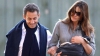 Nicolas Sarkozy şi Carla Bruni au ieşit pentru prima dată la plimbare cu micuţa Giulia (FOTO)