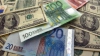 Leul s-a depreciat în raport cu euro şi valuta românească