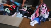 (VIDEO) Mărfuri periculoase pentru sănătate, ascunse printre haine second hand într-un TIR ce venea din Germania
