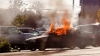 BMW în flăcări pe o stradă din capitală. Pompierii au intervenit cu două autospeciale
