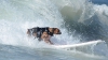 Concurs INEDIT: Zeci de câini au făcut surfing pe o plajă din California (VIDEO)