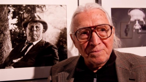 (VIDEO) Povestea unui veteran care a mers la război cu arma şi camera foto în mână