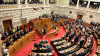 Bani pentru reforme. Parlamentul grec urmează să voteze legi de miliarde  