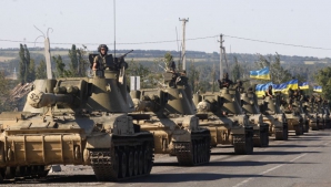 Kievul și forțele separatiste au început retragerea de tancuri din regiunea Donețk