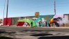 Mesaj de unitate! Mexicanii promovează pacea printr-un graffiti desenat pe un zid de la granița cu SUA