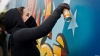 Chişinăul prinde culoare! Un grup de pictori îşi aştern fantezia pe zidurile unui stadion din Capitală 