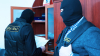 Un poliţist şi un şef al unei întreprinderi municipale din Donduşeni, reţinuţi pentru trafic de influenţă