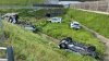 Mașini împrăștiate pe câmp, după ce un autotren care transporta automobile s-a răsturnat (FOTO)