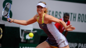 Мария Шарапова обыграла в 1/4 финала Открытого чемпионата Франции Гарбину Мугурусу