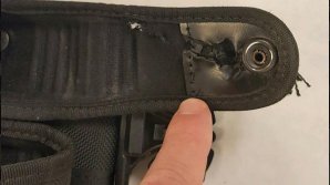 Ремень спас американского полицейского от пули